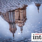 Reflection of a church in Italy in a puddle