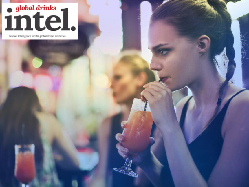 A woman enjoying a drink in a bar
