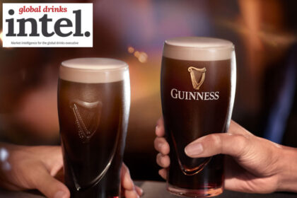 Two pints of Guinness on a bar