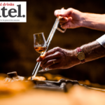 Cognac poured into a glass at Hine 's cellars