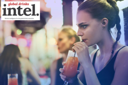 A woman enjoying a drink in a bar