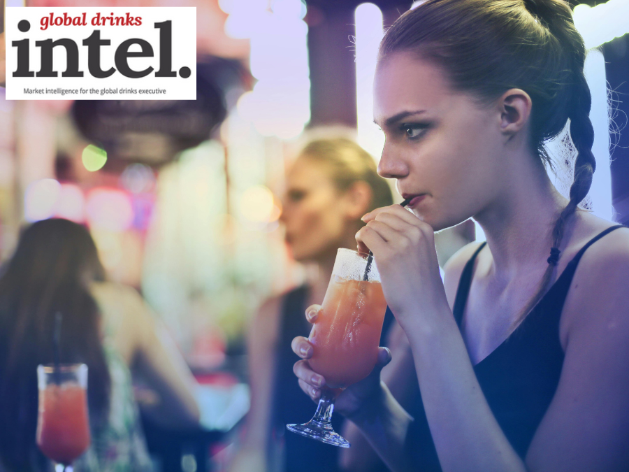 A woman enjoying a drink in a bar