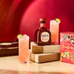 Bottle of and box for Don Julio tequila next to a record player