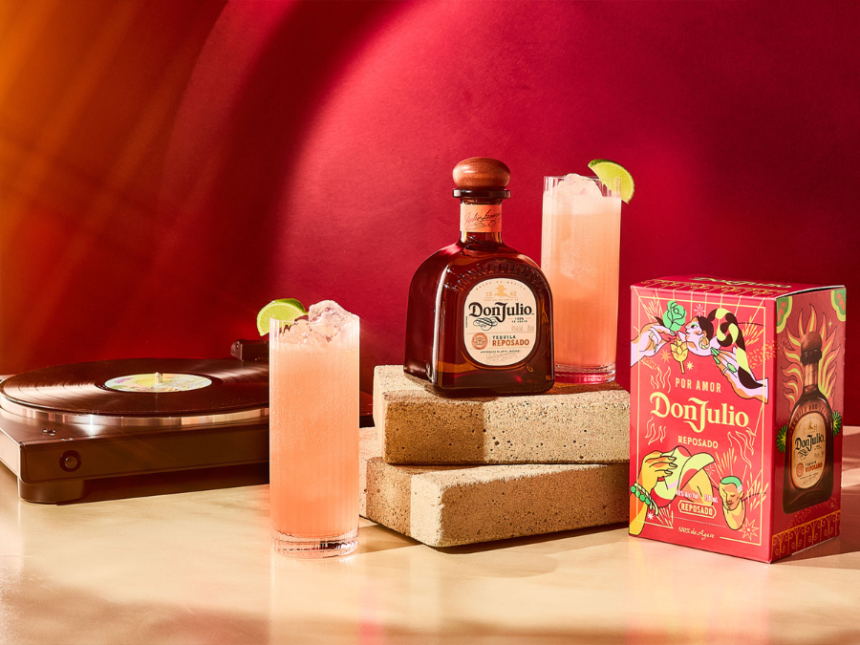 Bottle of and box for Don Julio tequila next to a record player