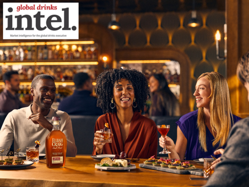 Drinkers sitting at a table with a bottle of Elijah Craig American whiskey