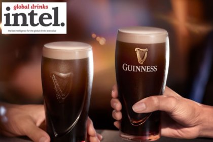Two pints of Guinness on a bar