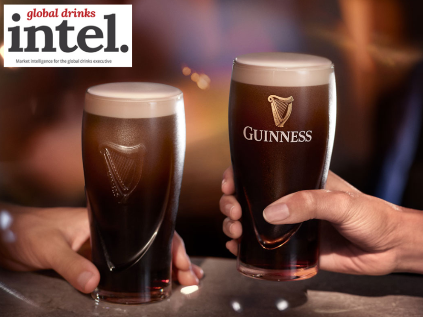 Two pints of Guinness on a bar