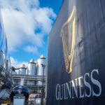 Guinness logo on a wall at St James's Gate brewery in Dublin