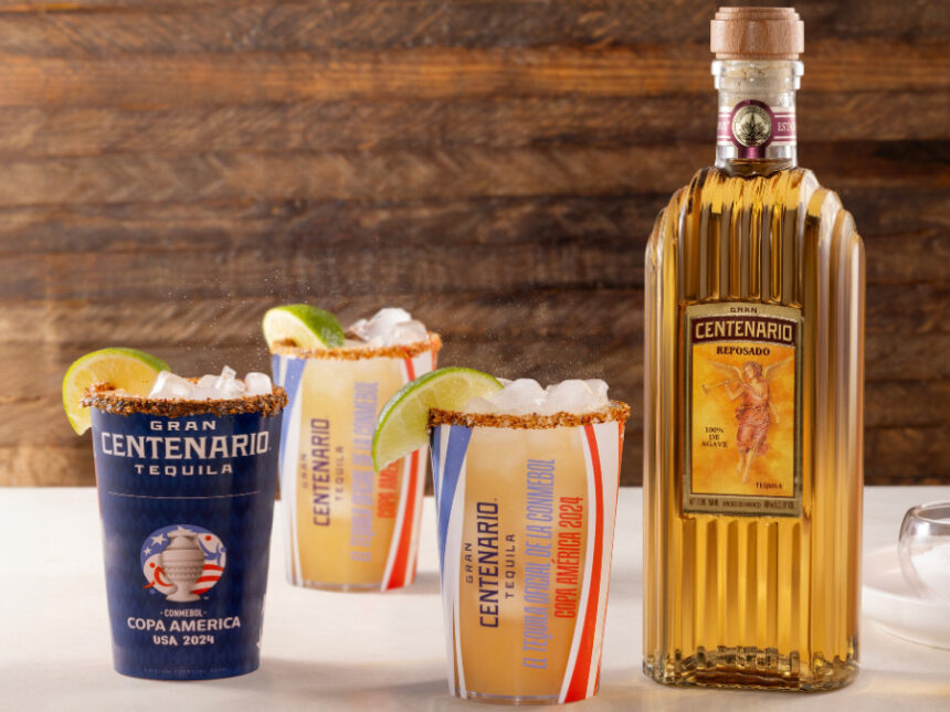 Bottle of Gran Centenario reposado tequila with co-branded Copa America cups