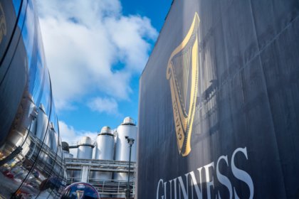 Guinness logo on a wall at St James's Gate brewery in Dublin
