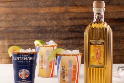 Bottle of Gran Centenario reposado tequila with co-branded Copa America cups