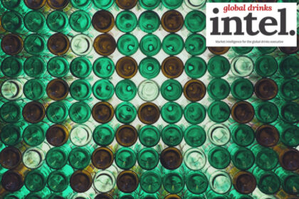 View from below of multiple brown and green glass bottles