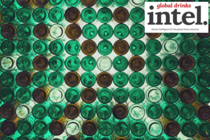 View from below of multiple brown and green glass bottles