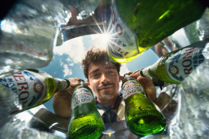 Charles Leclerc with bottles of Peroni 0.0%
