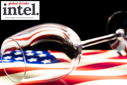 Empty wine glass on top of a US flag