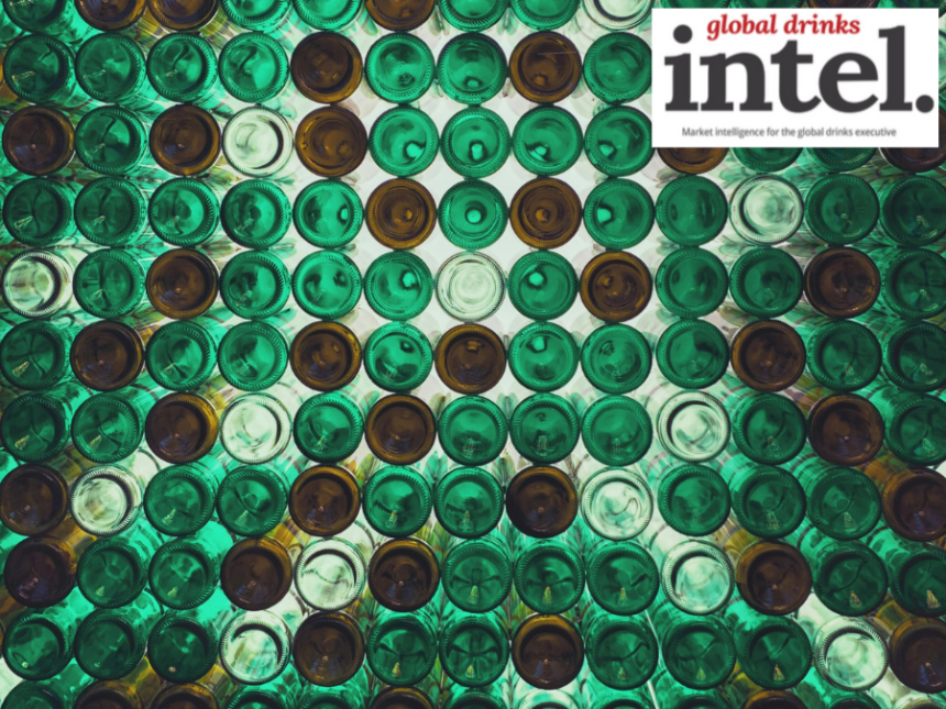 View from below of multiple brown and green glass bottles