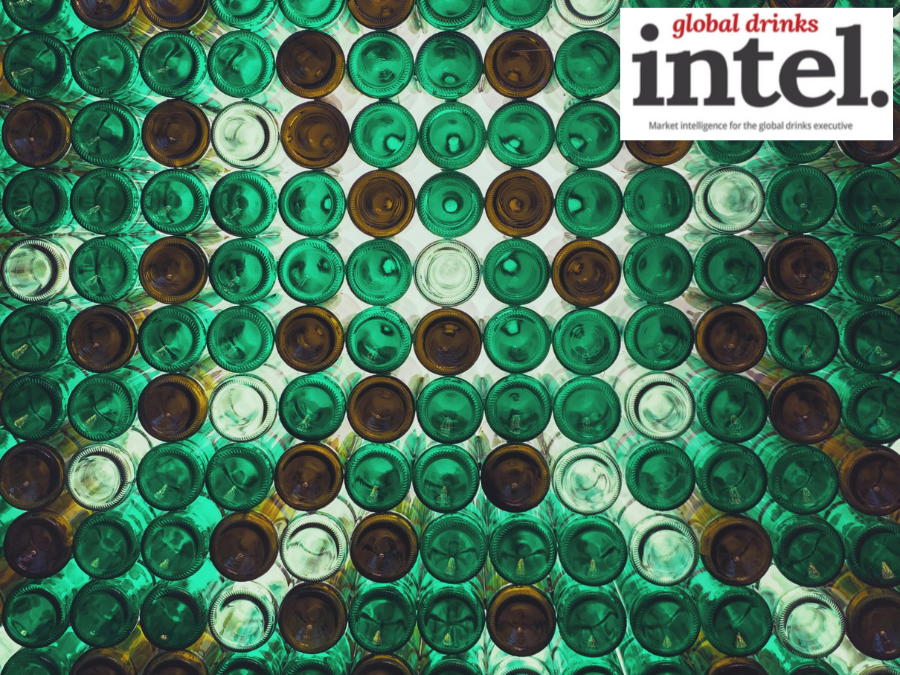 View from below of multiple brown and green glass bottles