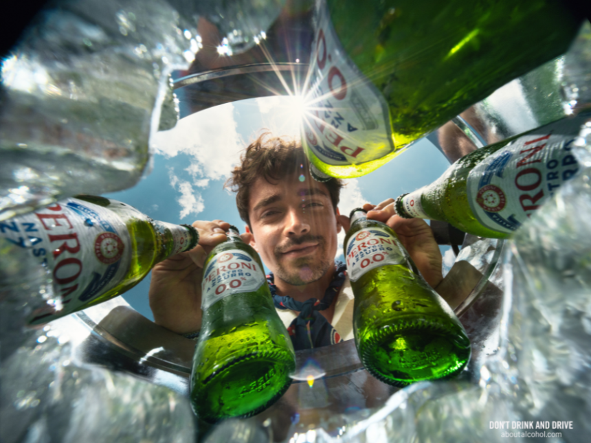 Charles Leclerc with bottles of Peroni 0.0%