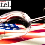 Empty wine glass on top of a US flag