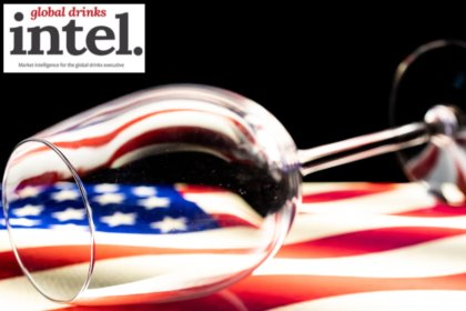 Empty wine glass on top of a US flag