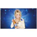 Dolly Parton holding a bottle of her branded wine