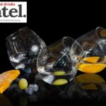 Three serves of Grappa Alex Blanca with pieces of fruit