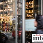 Logo of The Whisky Exchange on a door into one of its retail outlets