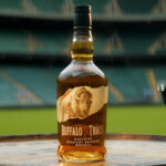 Buffalo Trace bottle with a rugby stadium backdrop