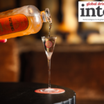 Bottle of Renais gin being poured into an elegant shot glass