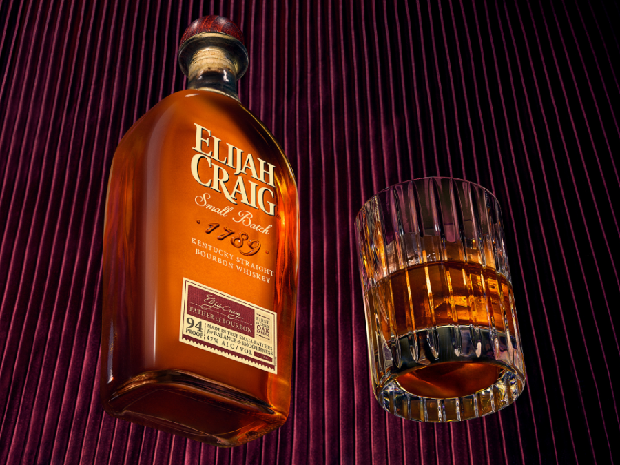 Bottle of Elijah Craig American whiskey with an old fashioned cocktail serve