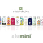 Sustainaholics logo with row of 5cl 100% recycled aluminium bottles containing spirits