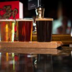 Three pints of beer on a bar