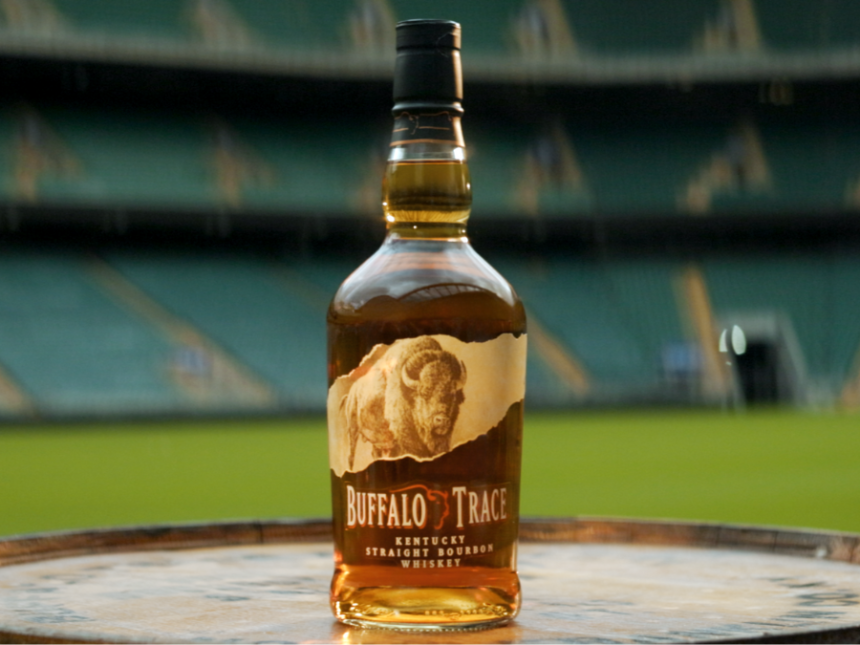 Buffalo Trace bottle with a rugby stadium backdrop