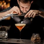 Bartender making a cocktail on a bar