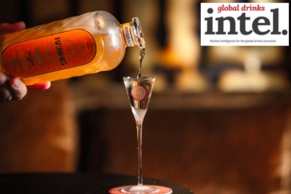 Bottle of Renais gin being poured into an elegant shot glass