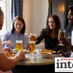 Four consumers having a meal and drinking Henry Westons cider