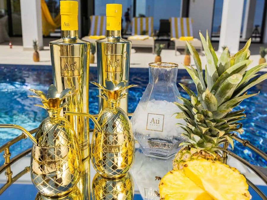 Two bottles of Au Vodka Pineapple