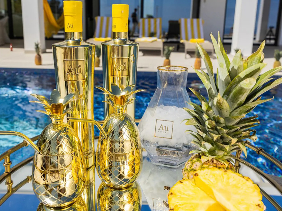 Two bottles of Au Vodka Pineapple