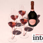 Bottle of Laurent-Perrier Cuvee Rose with four glasses