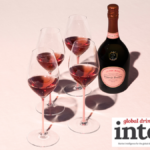 Bottle of Laurent-Perrier Cuvee Rose with four glasses