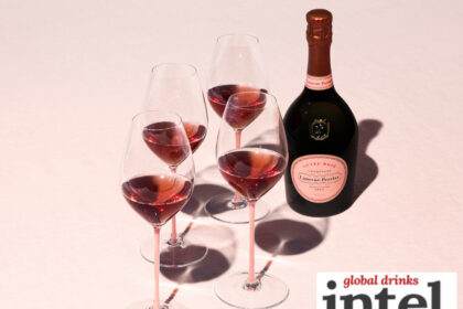 Bottle of Laurent-Perrier Cuvee Rose with four glasses