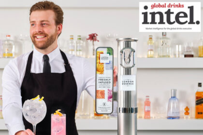 Bartender with a serve standing next to a London Essence-branded font on a bar