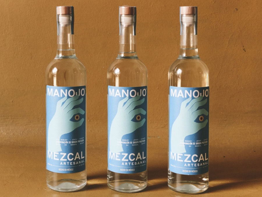 Three bottles of Manojo Mezcal