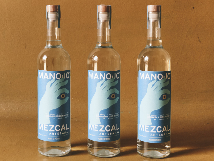 Three bottles of Manojo Mezcal