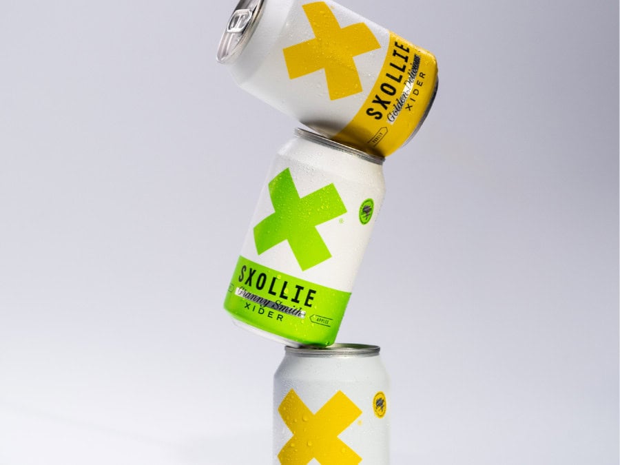 Three cans of SXOLLIE Cider