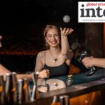 Customers at a bar with a floating bubble of aroma smoke