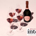 Bottle of Laurent-Perrier Cuvee Rose with four glasses