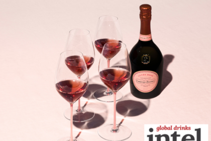 Bottle of Laurent-Perrier Cuvee Rose with four glasses