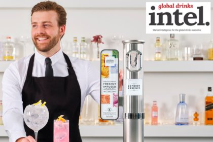 Bartender with a serve standing next to a London Essence-branded font on a bar