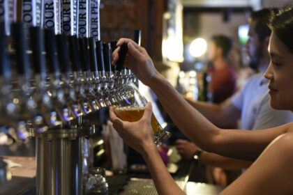 Bartender pouring a draught beer
